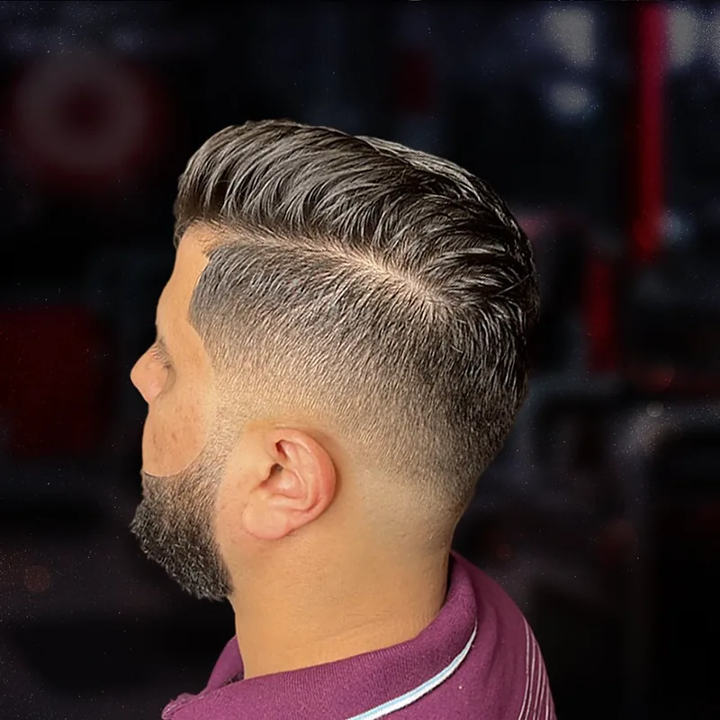 Comb-over with a hard part and fade
